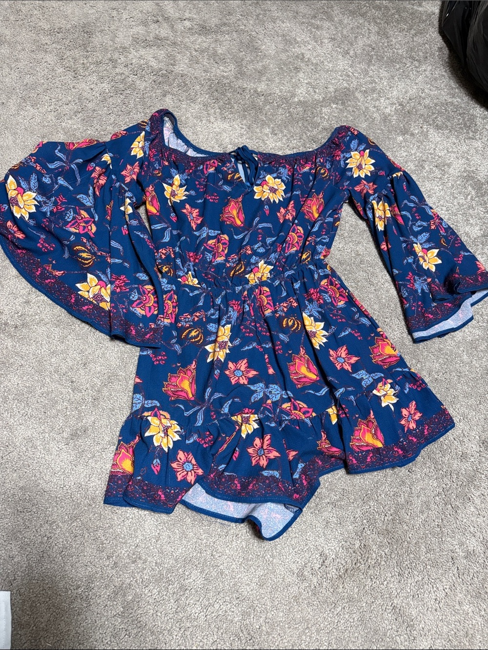 Charming off-shoulder top with flared bell sleeves and a gathered waist